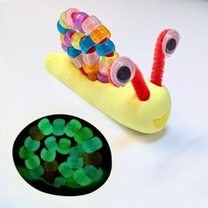 Photo of a snail made with air-dry clay and glow-in-the-dark pony beads.