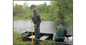 Using boat to clean up Hedges Creek Using boat to clean up Hedges Creek
